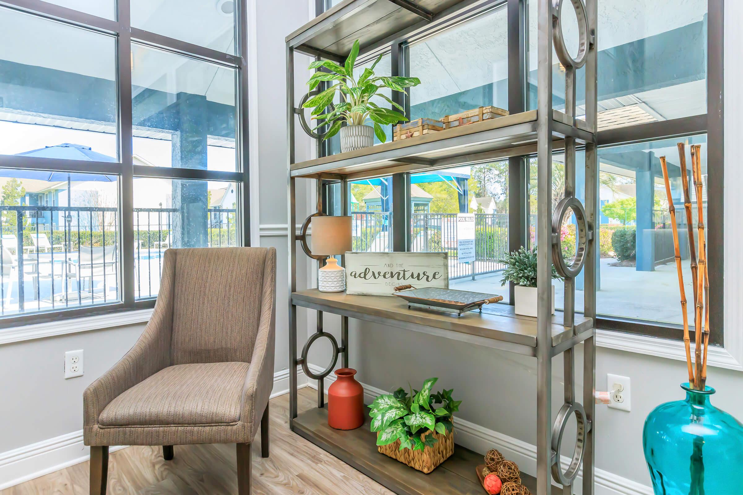 a chair sitting in front of a window