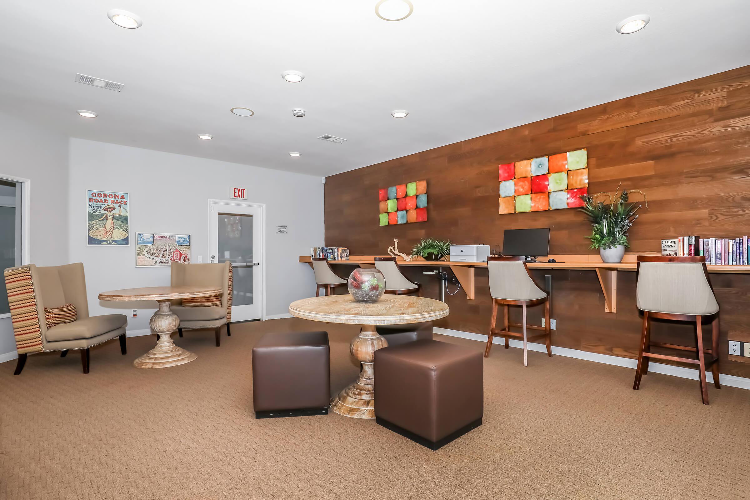 a living room filled with furniture and a flat screen tv