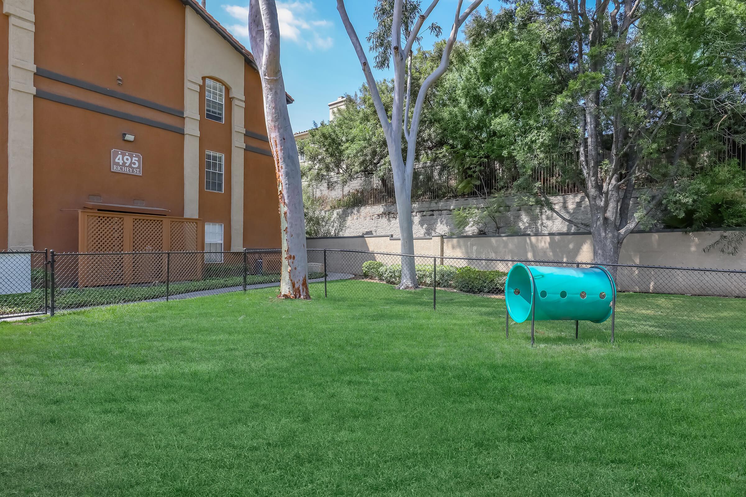 a green lawn in front of a house