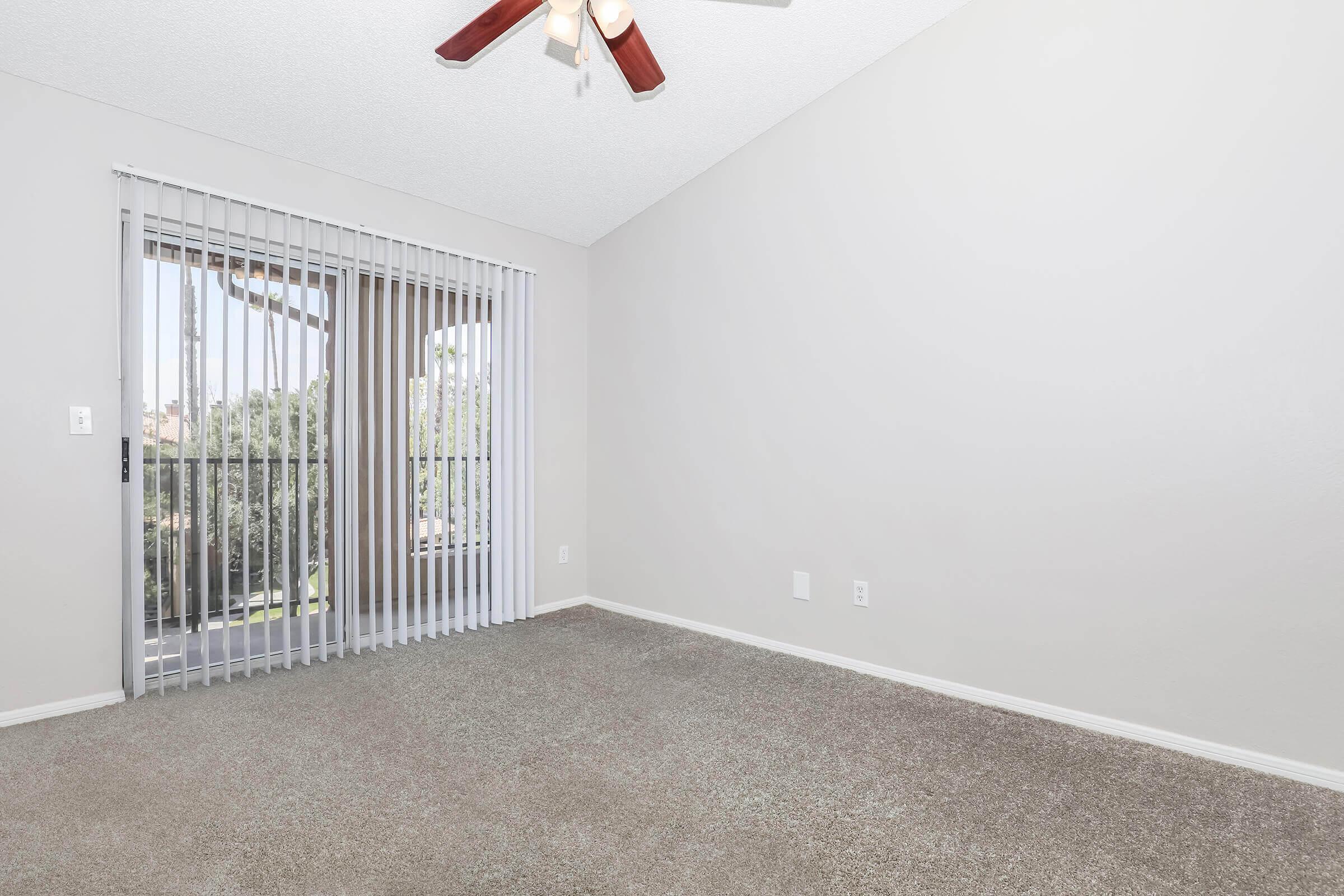 a bedroom with a large window