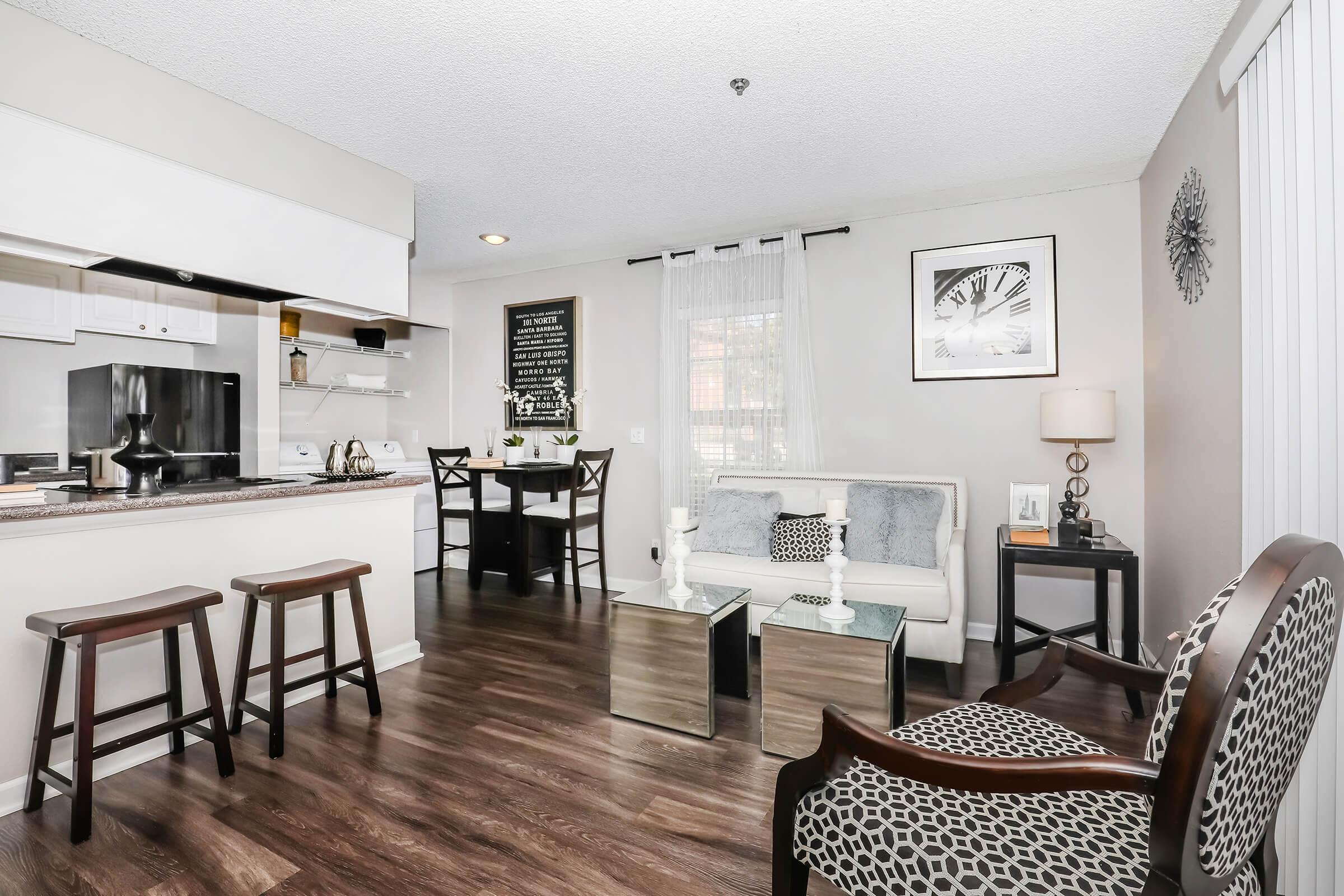 a living room filled with furniture and a table