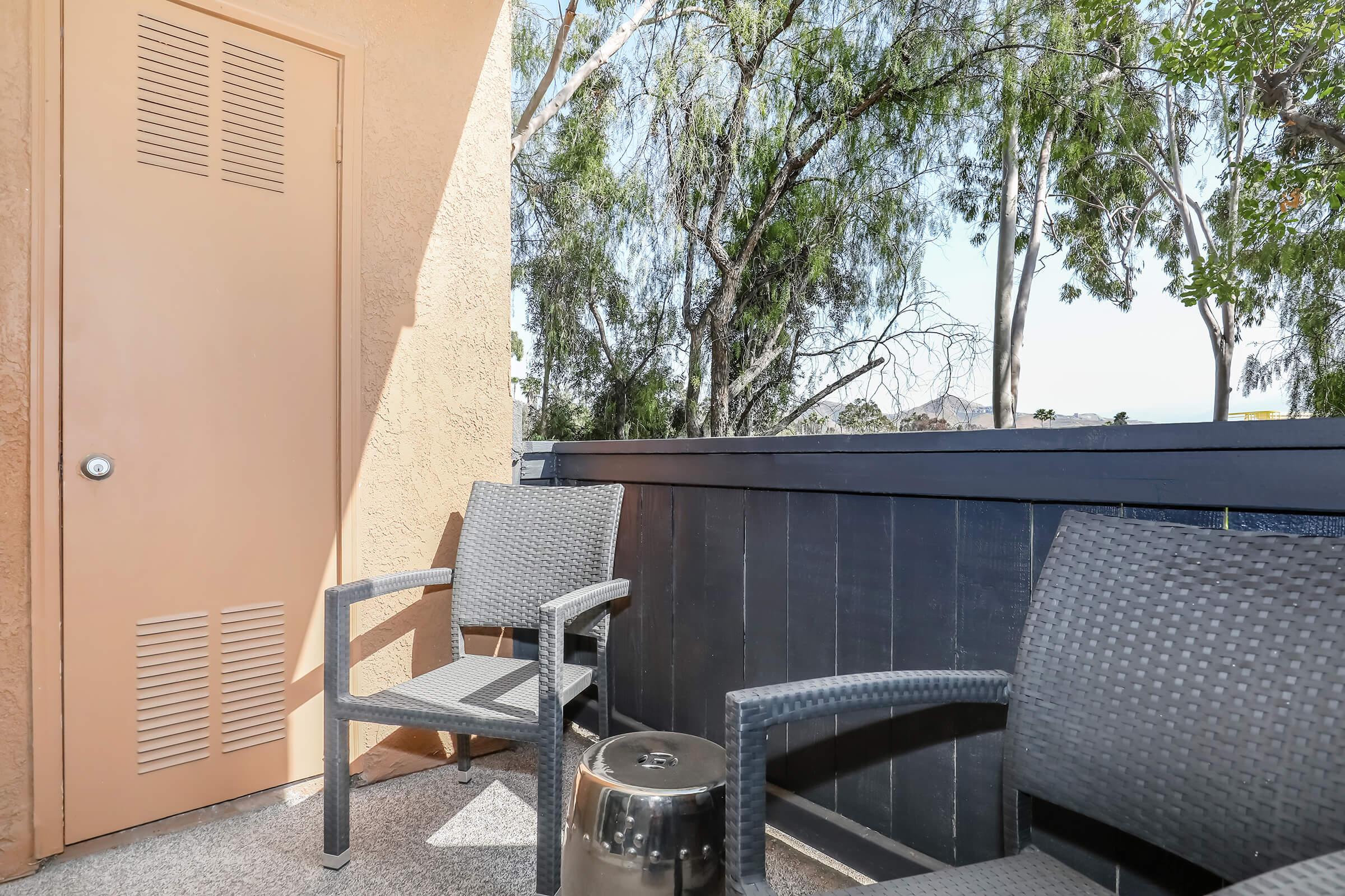 a chair sitting in front of a building