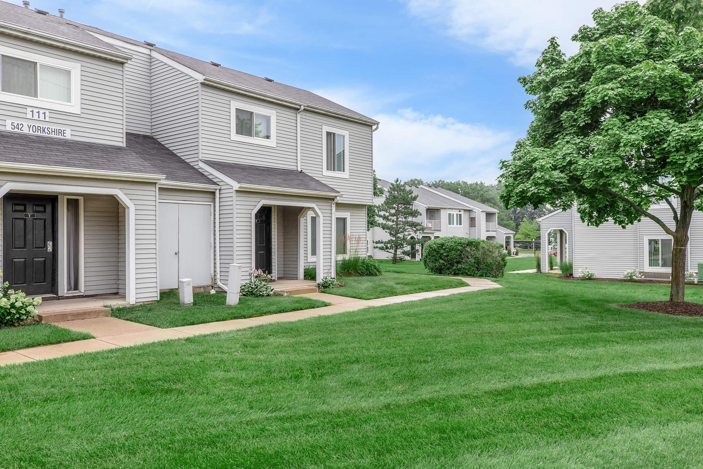 a large lawn in front of a house