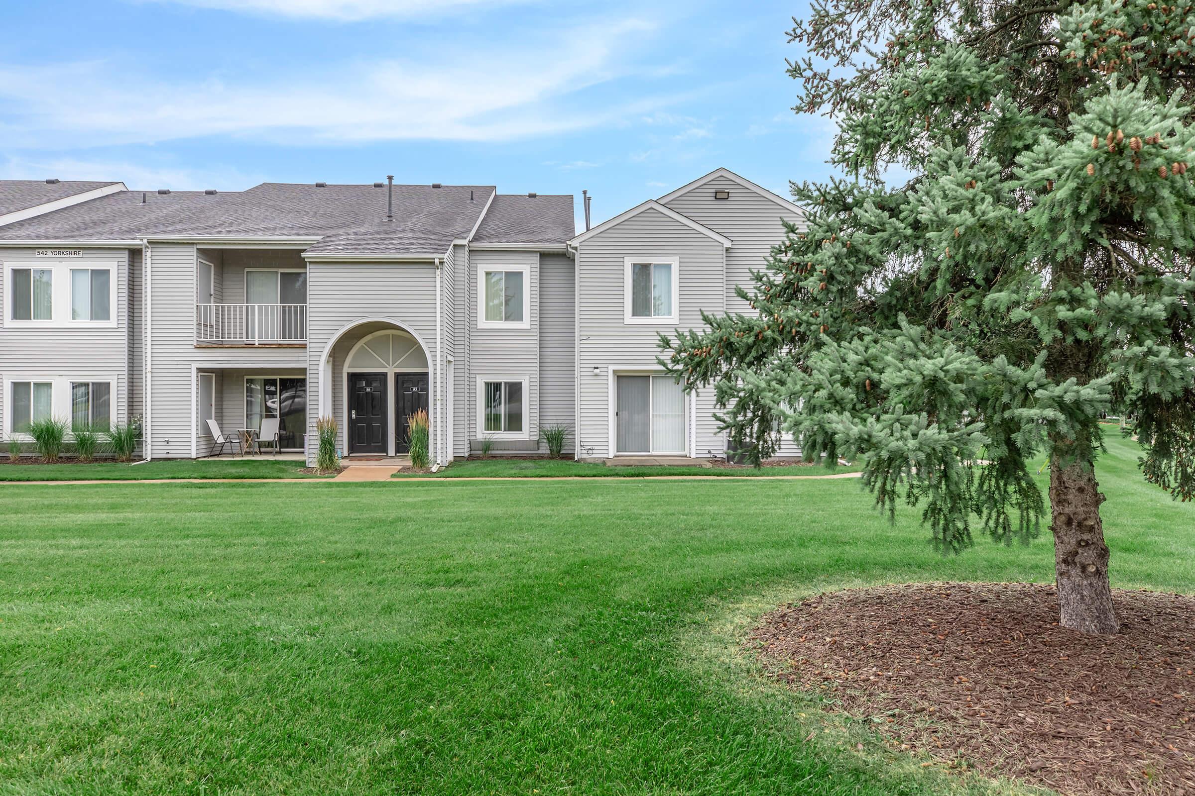 a large lawn in front of a house