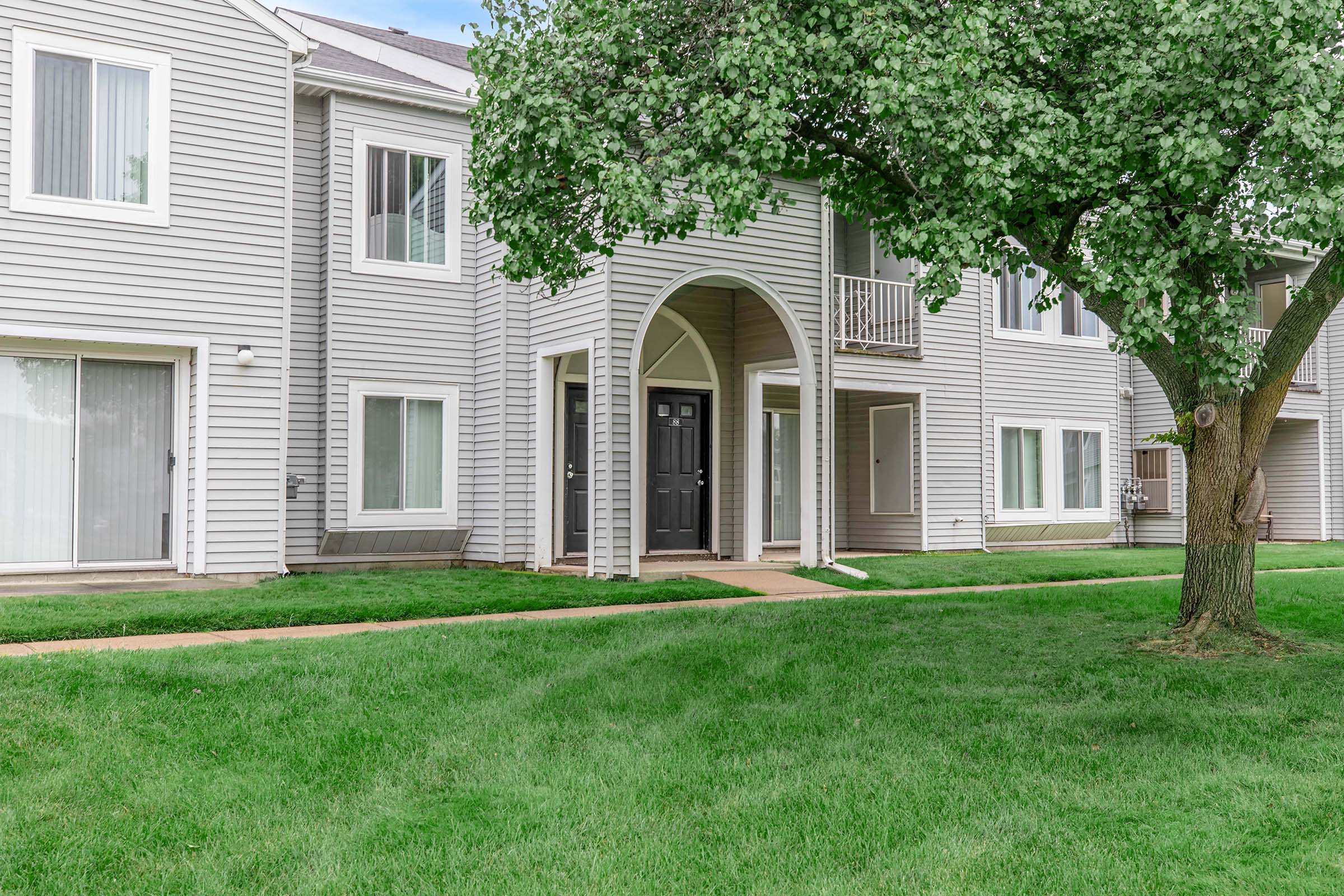 a large lawn in front of a house