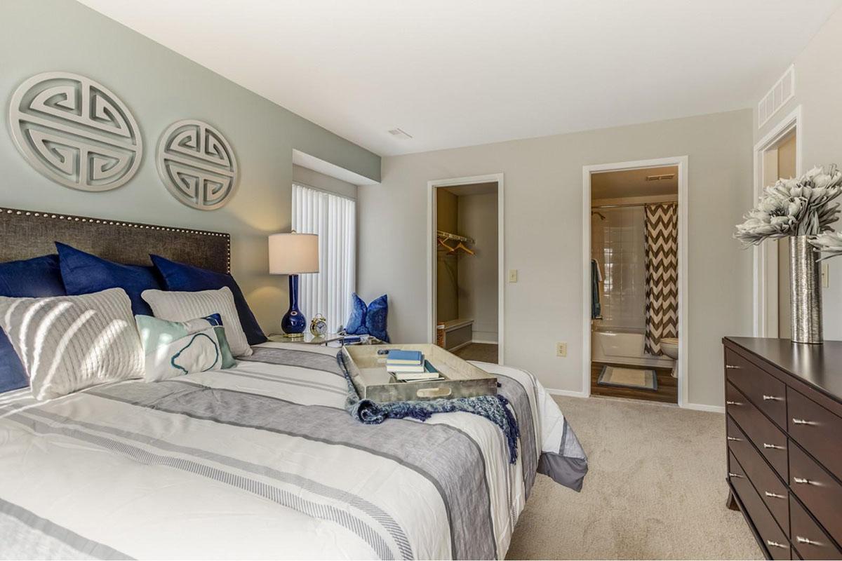 a bedroom with a large bed in a room