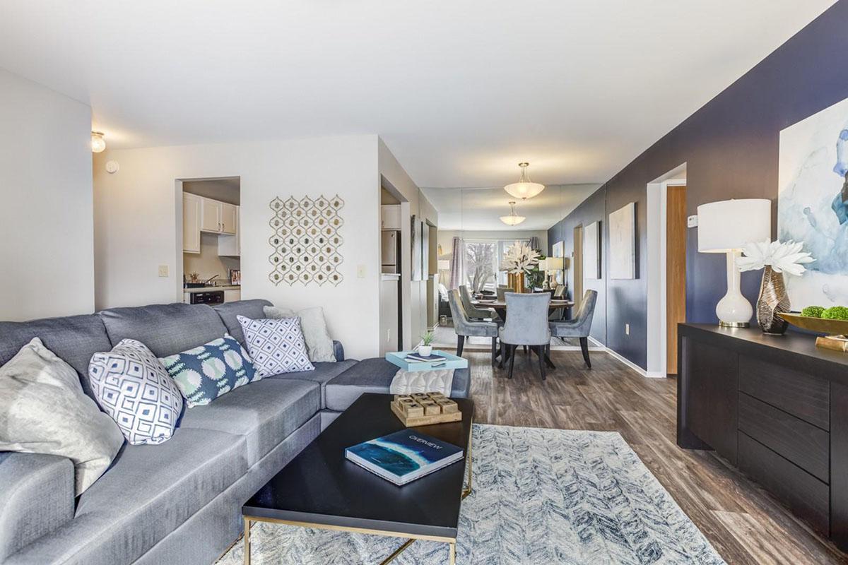a living room filled with furniture and a flat screen tv