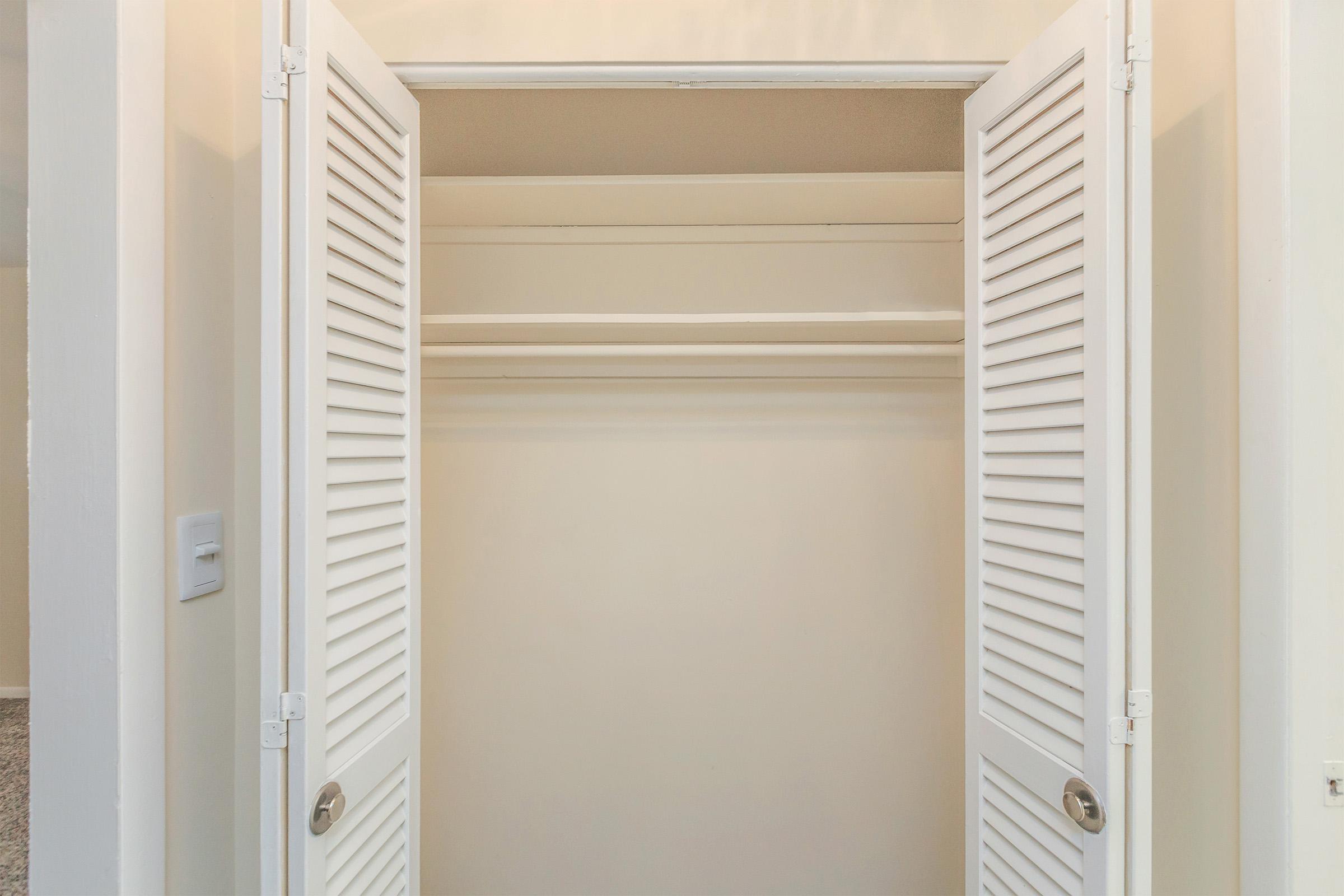 a white refrigerator freezer sitting next to a door