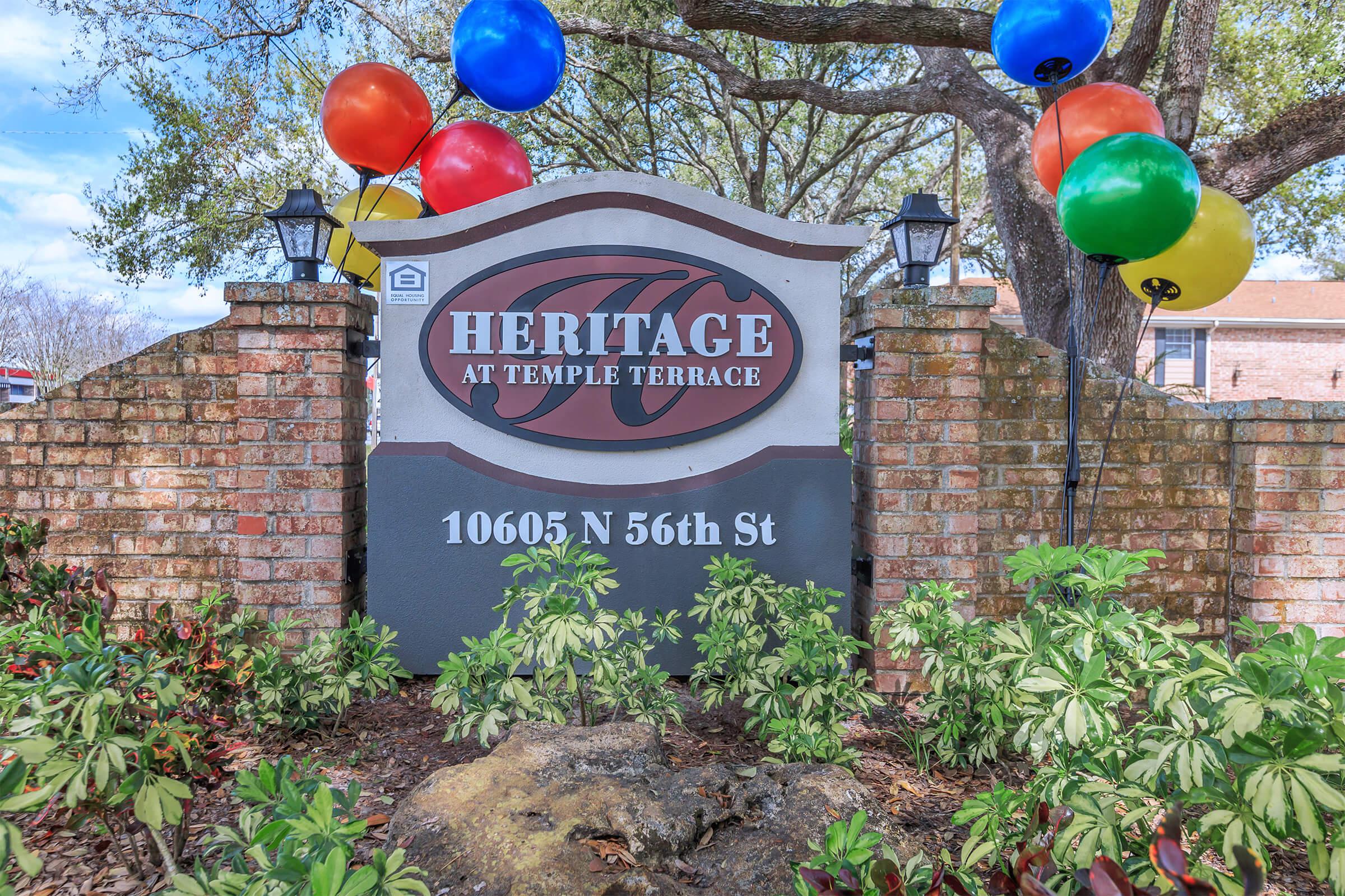 a sign in front of a brick building