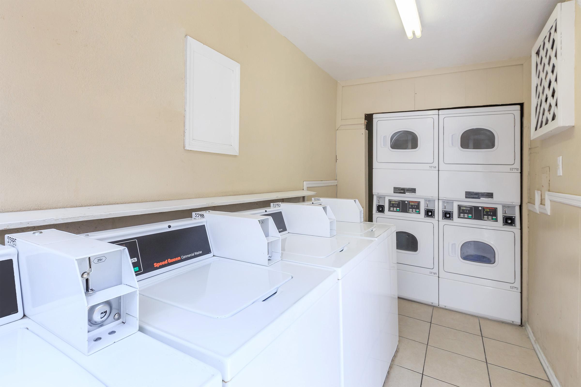 a white refrigerator freezer sitting inside of a kitchen