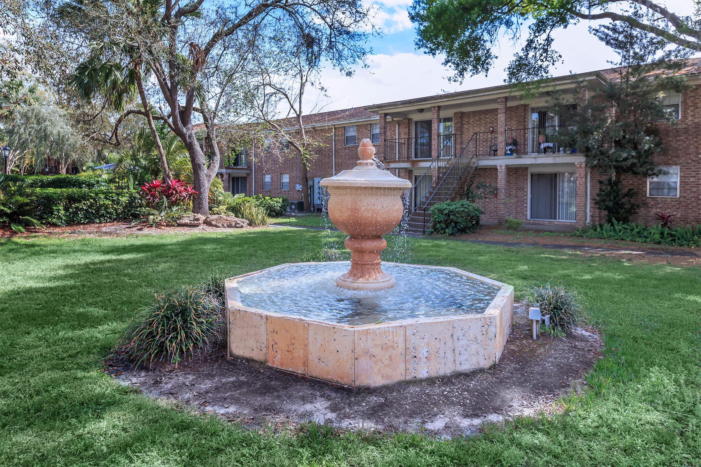 a fire hydrant in front of a brick building