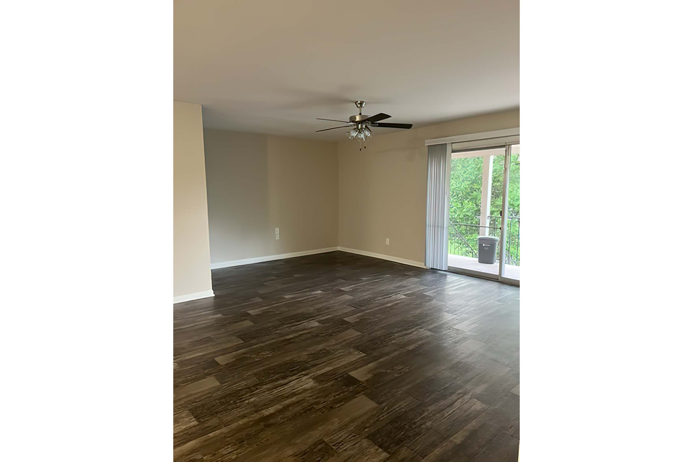 a large empty room with a wooden floor