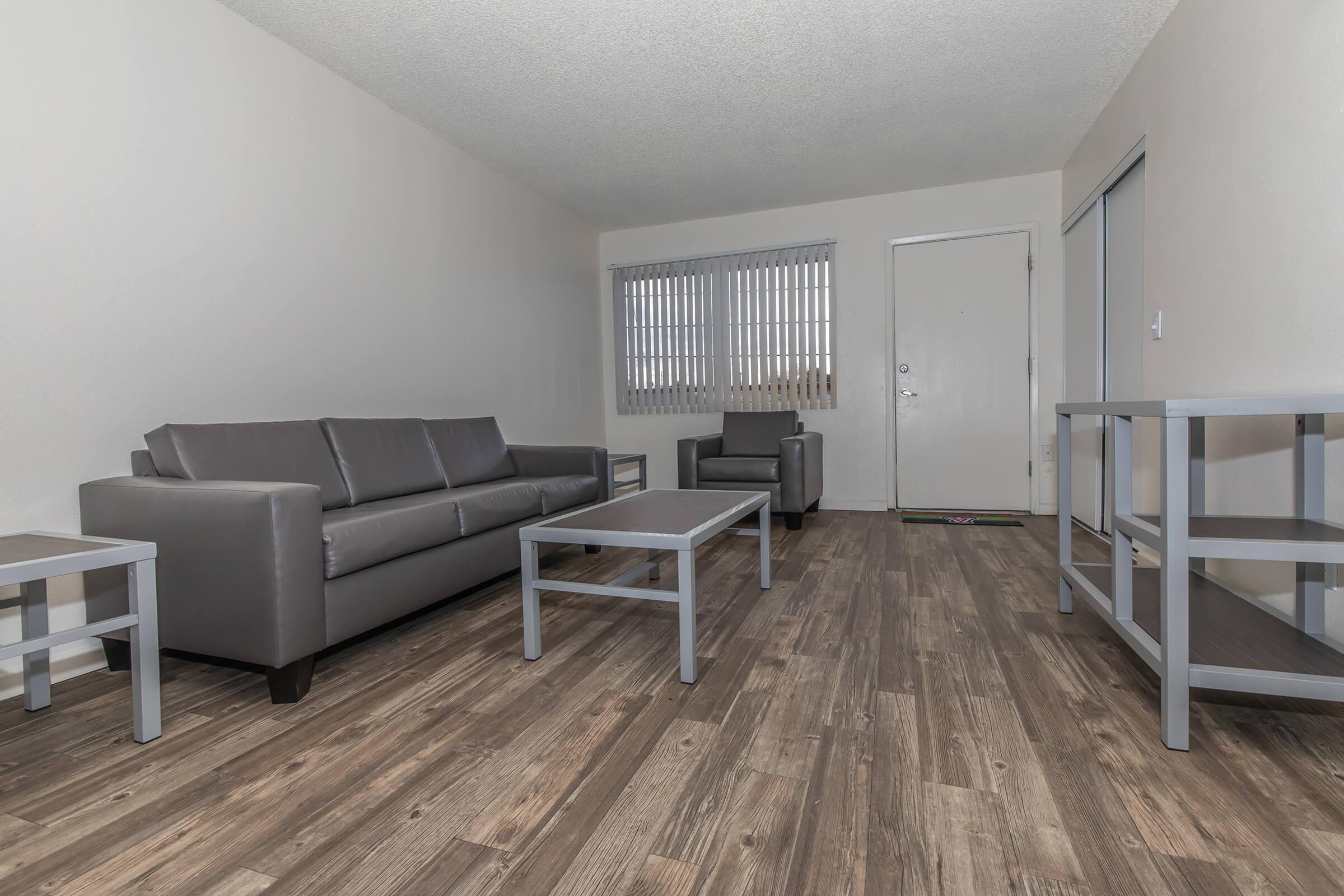 a living room with a wooden floor