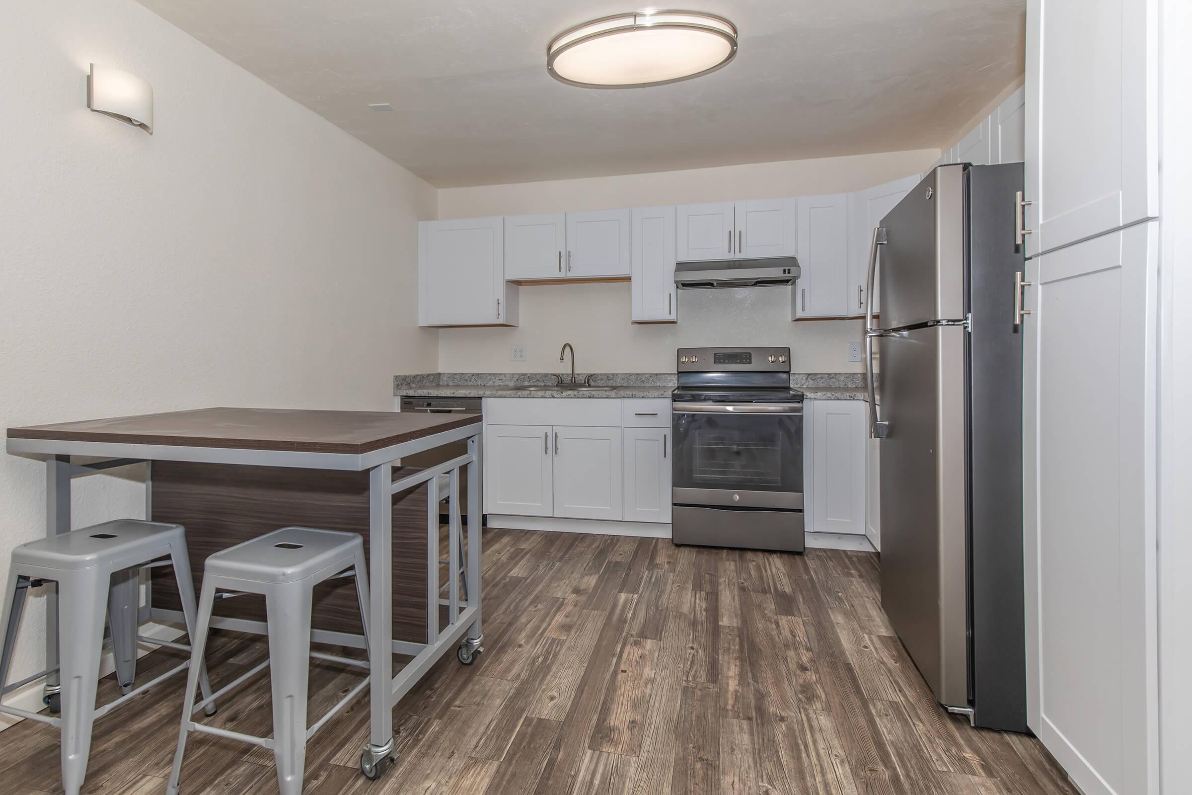 a large kitchen with stainless steel appliances