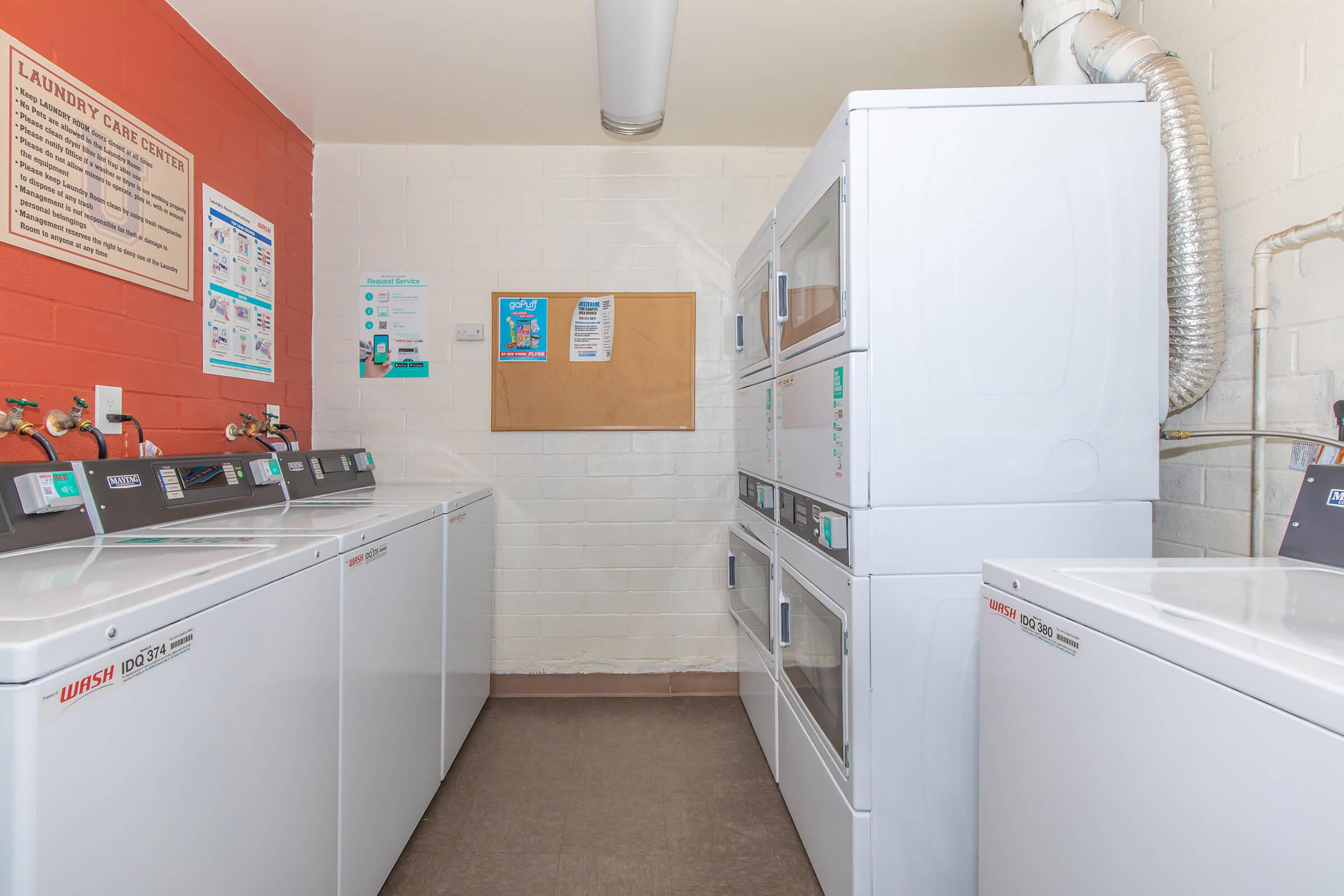 a kitchen with a refrigerator and a microwave