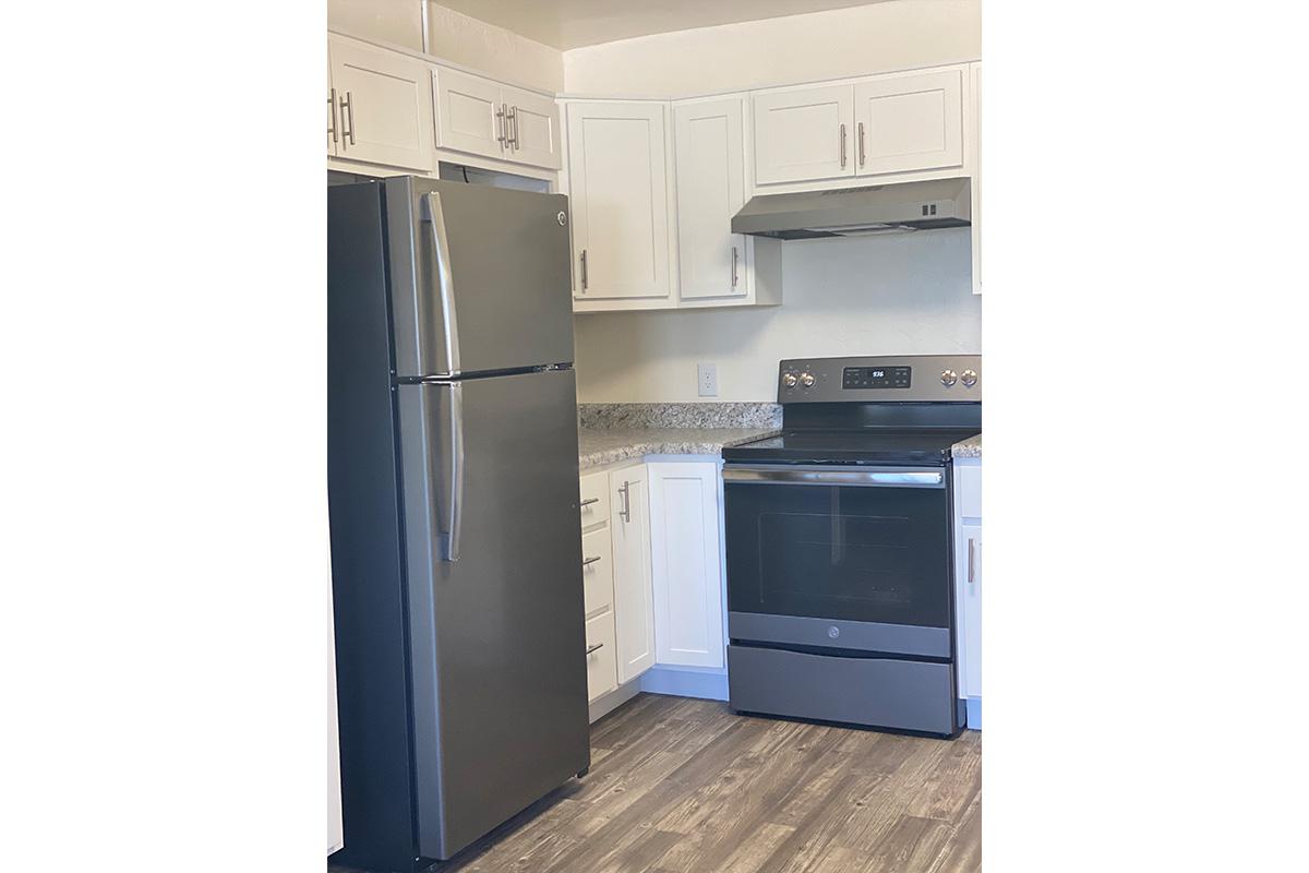 a white refrigerator freezer sitting inside of a kitchen