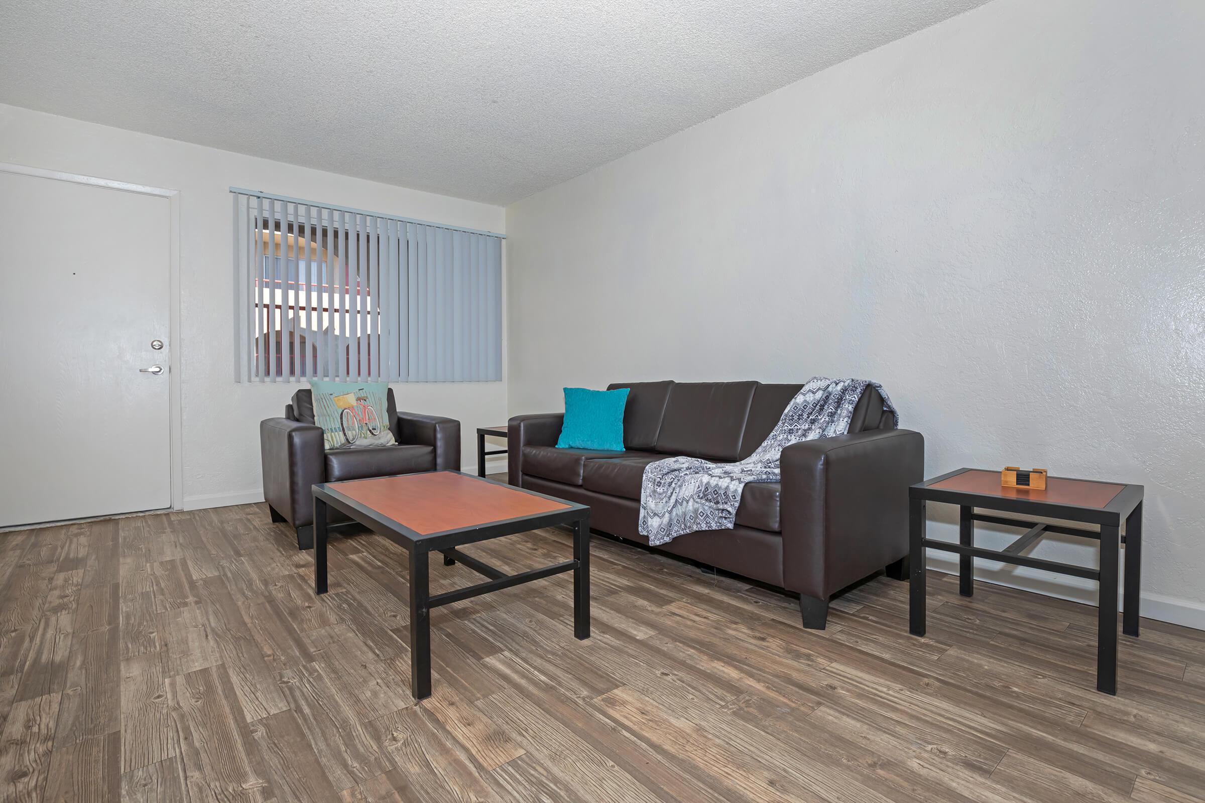 a living room filled with furniture and a tv