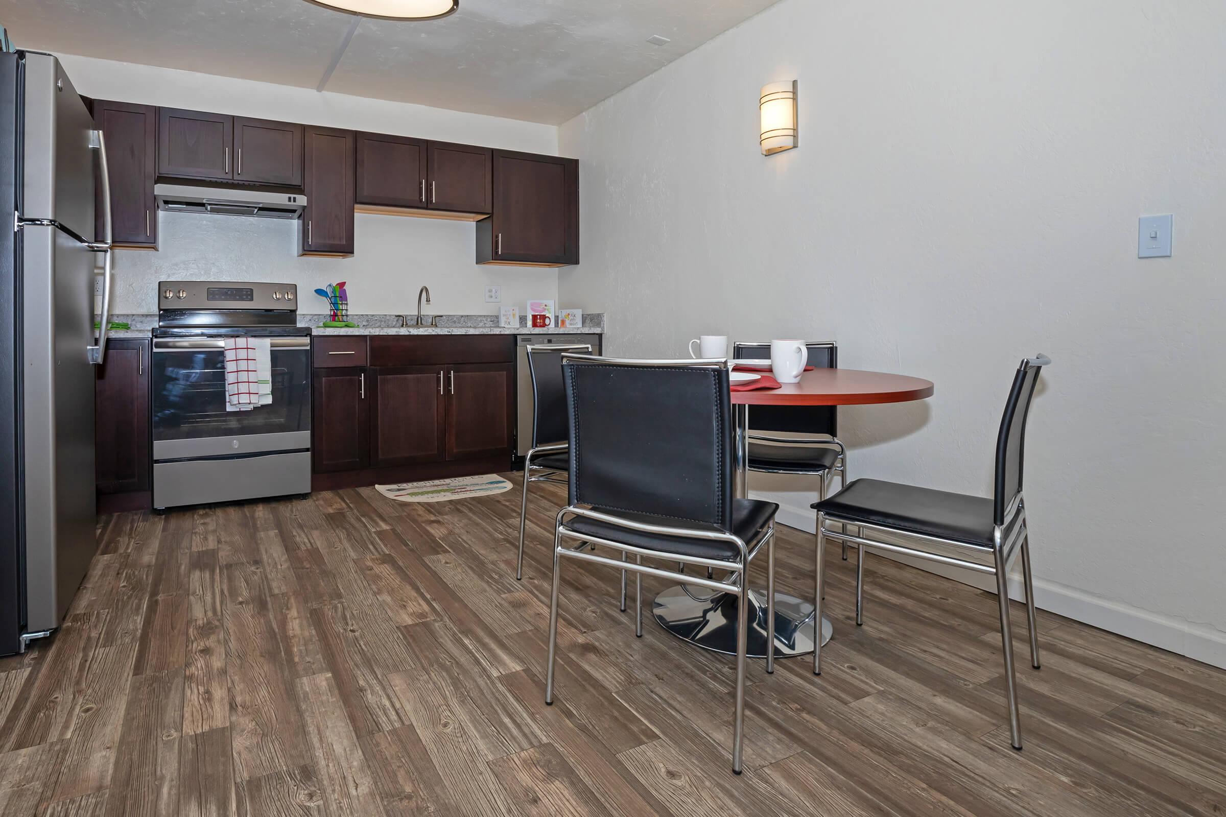 a kitchen filled with lots of furniture