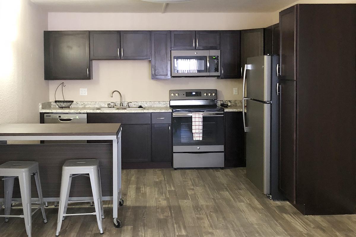 a modern kitchen with stainless steel appliances