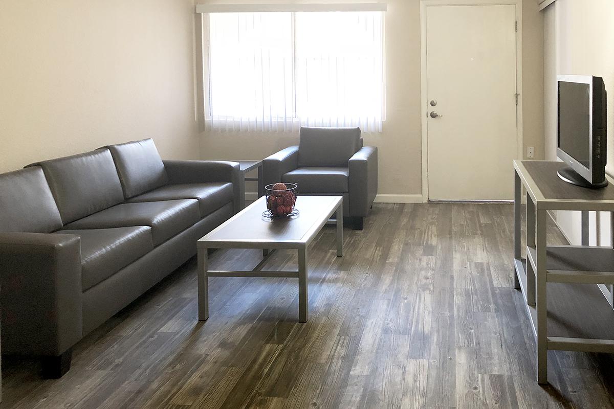 a living room with a leather chair