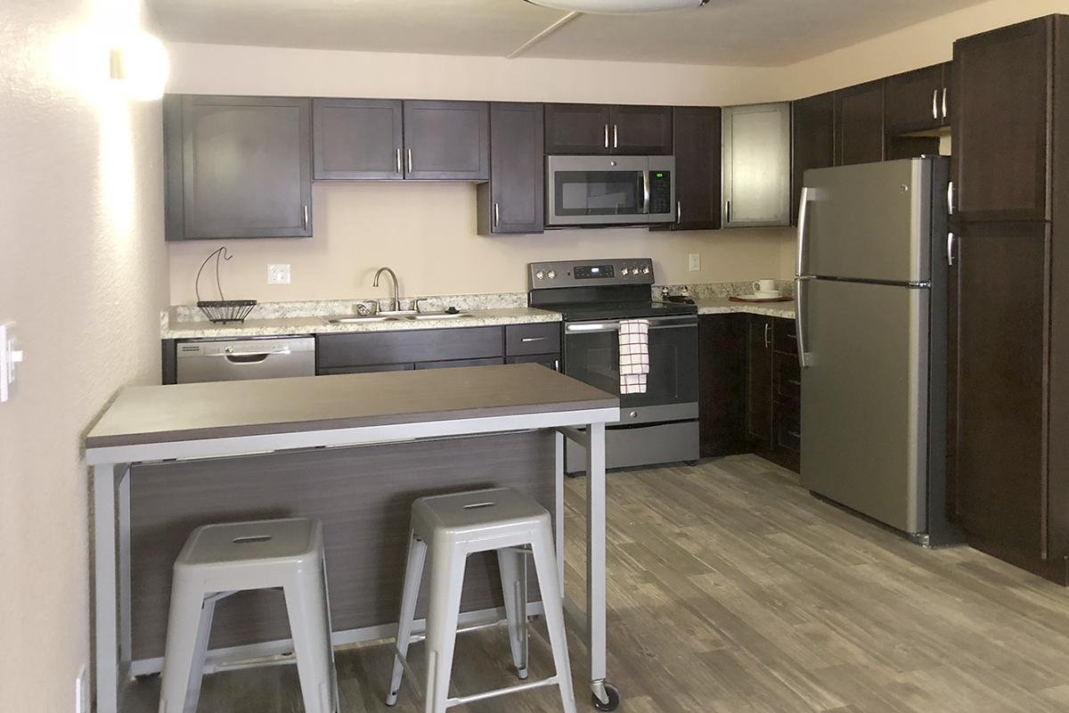 a modern kitchen with stainless steel appliances