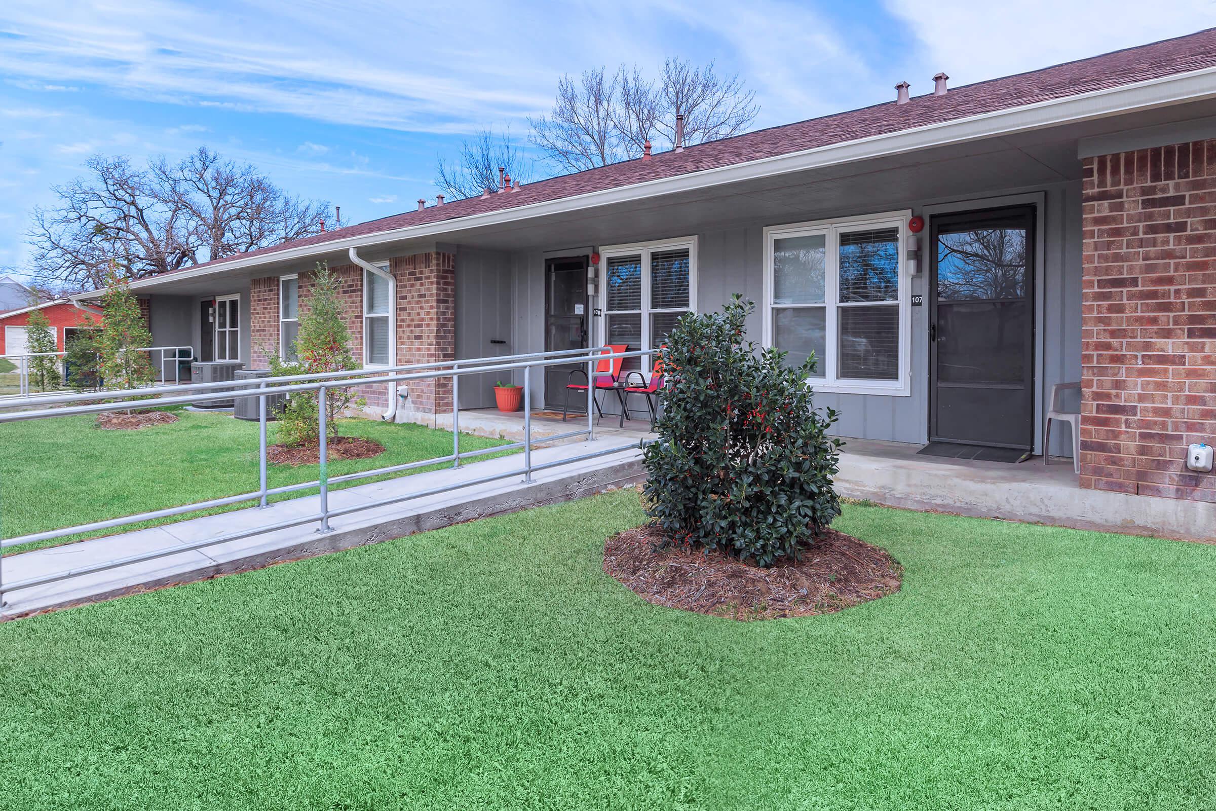 a large lawn in front of a house