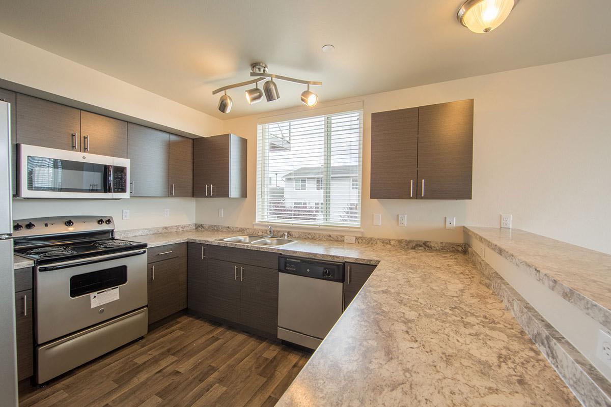 a modern kitchen with stainless steel appliances