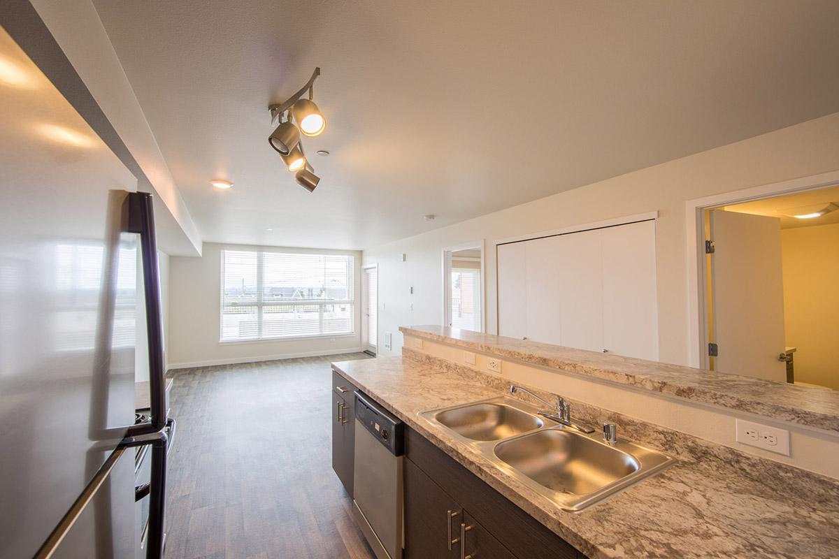 a large kitchen with stainless steel appliances