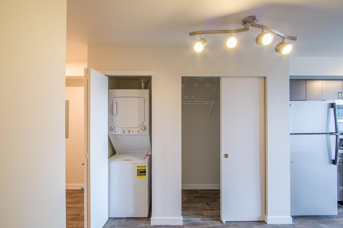 a white refrigerator freezer sitting inside of a building