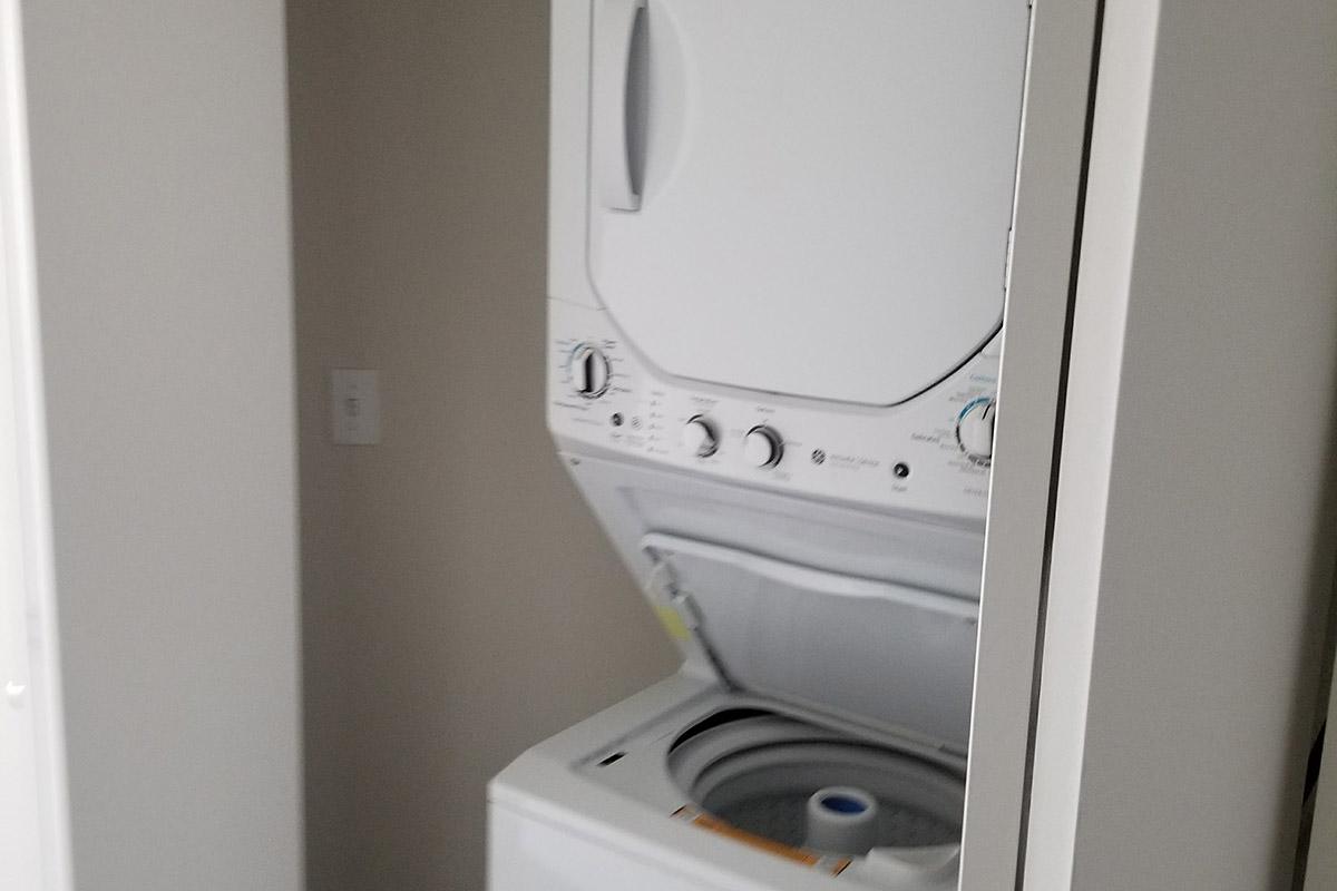 a white sink sitting next to a door