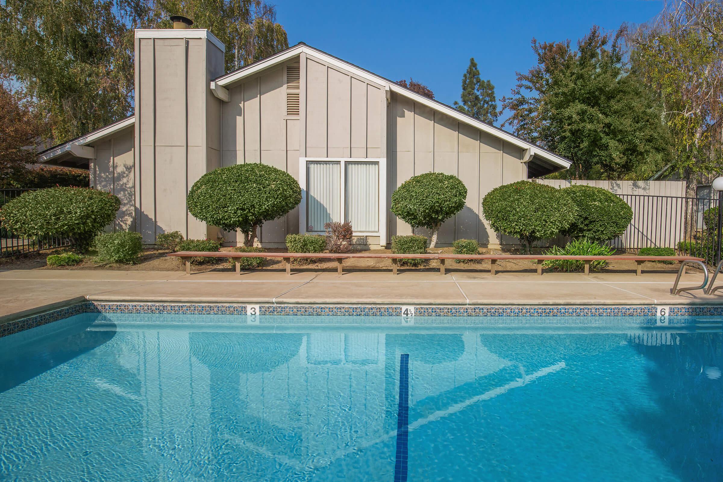 a pool in front of a building