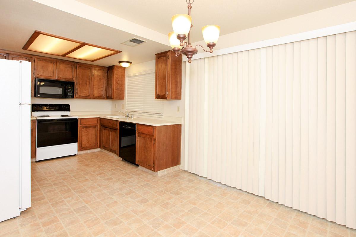 a kitchen with a stove and a refrigerator