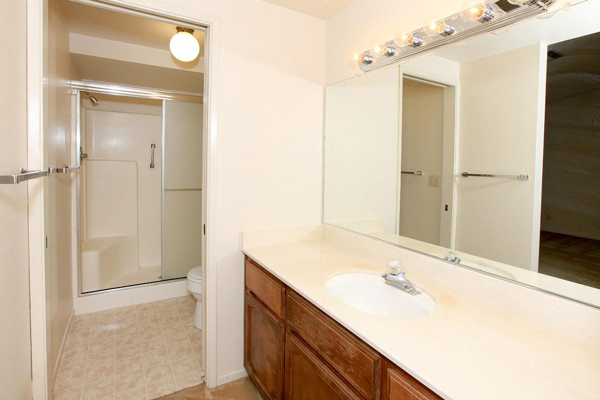 a large white tub next to a sink