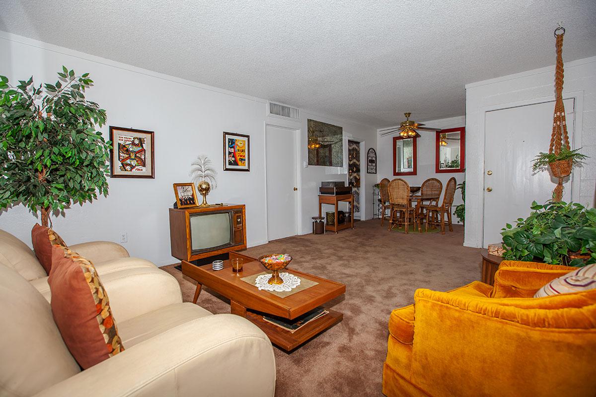 LUSH LIVING ROOM AT THE PALMS APARTMENTS IN LAS VEGAS