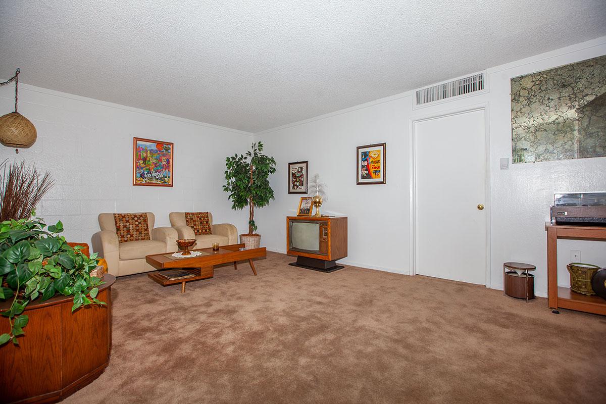 SPACIOUS LIVING ROOM AT THE PALMS APARTMENTS IN LAS VEGAS