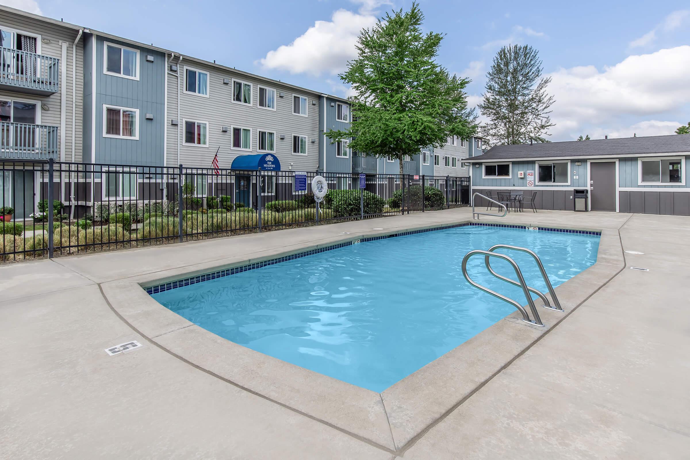 a pool next to a building