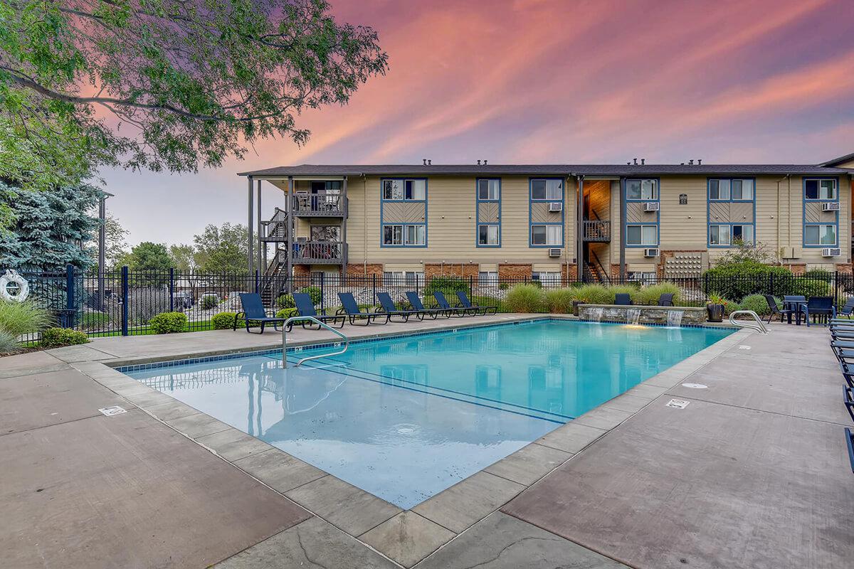 a house with a pool outside of a building