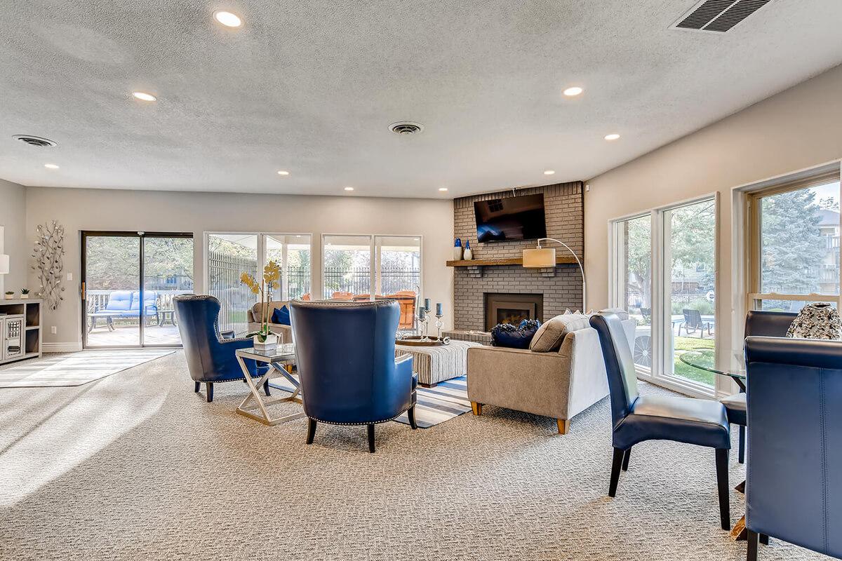 a living room filled with furniture and a large window