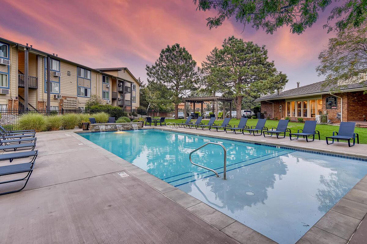 a house with a pool outside of a building