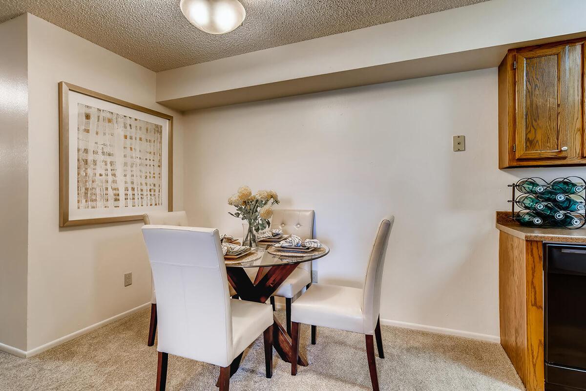 a living room filled with furniture and a large window