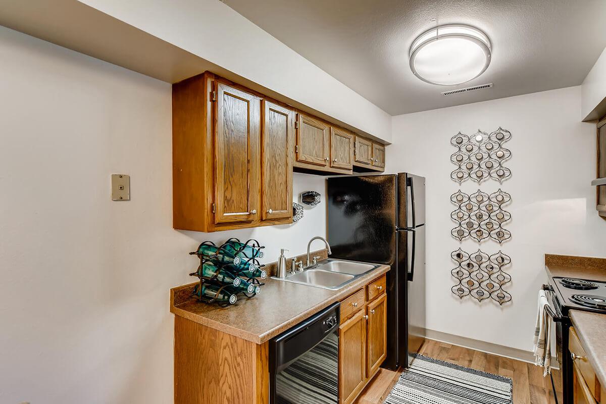 a kitchen with a stove top oven sitting inside of a room