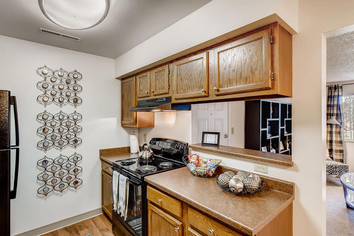 CHARMING KITCHEN WITH BLACK APPLIANCES