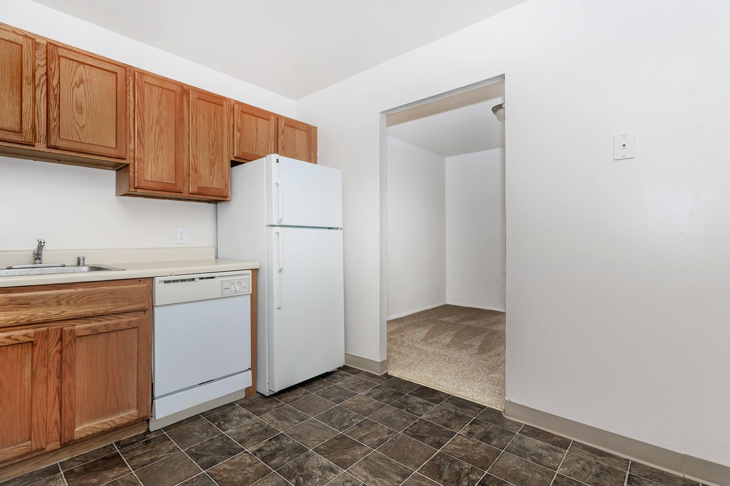 a kitchen with a stove and a refrigerator