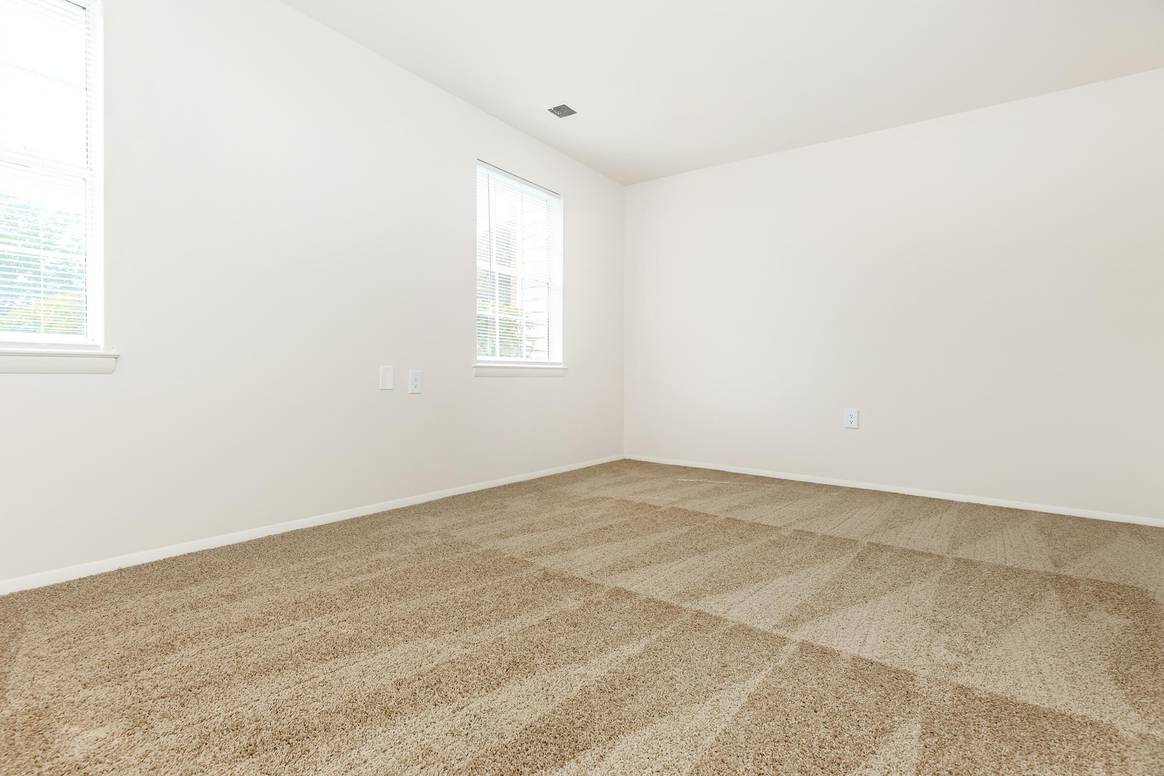 a bedroom with a large window