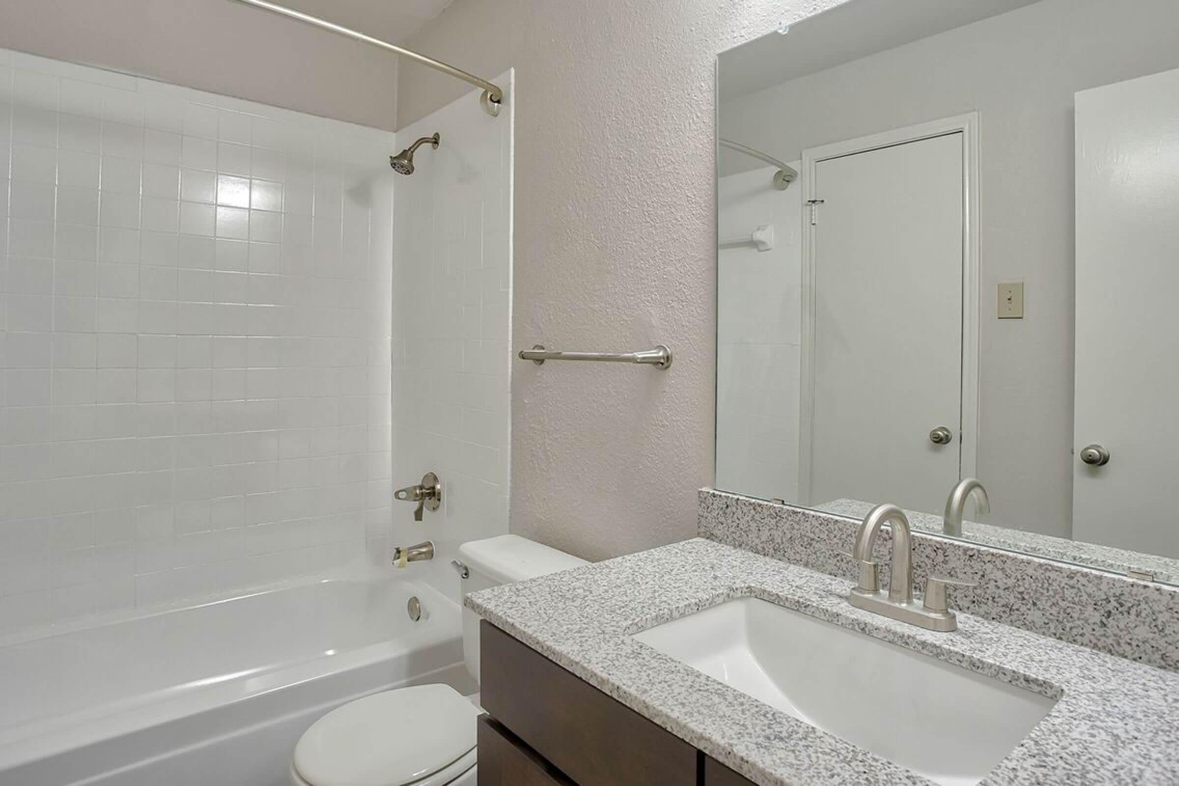 a room with a sink and a mirror