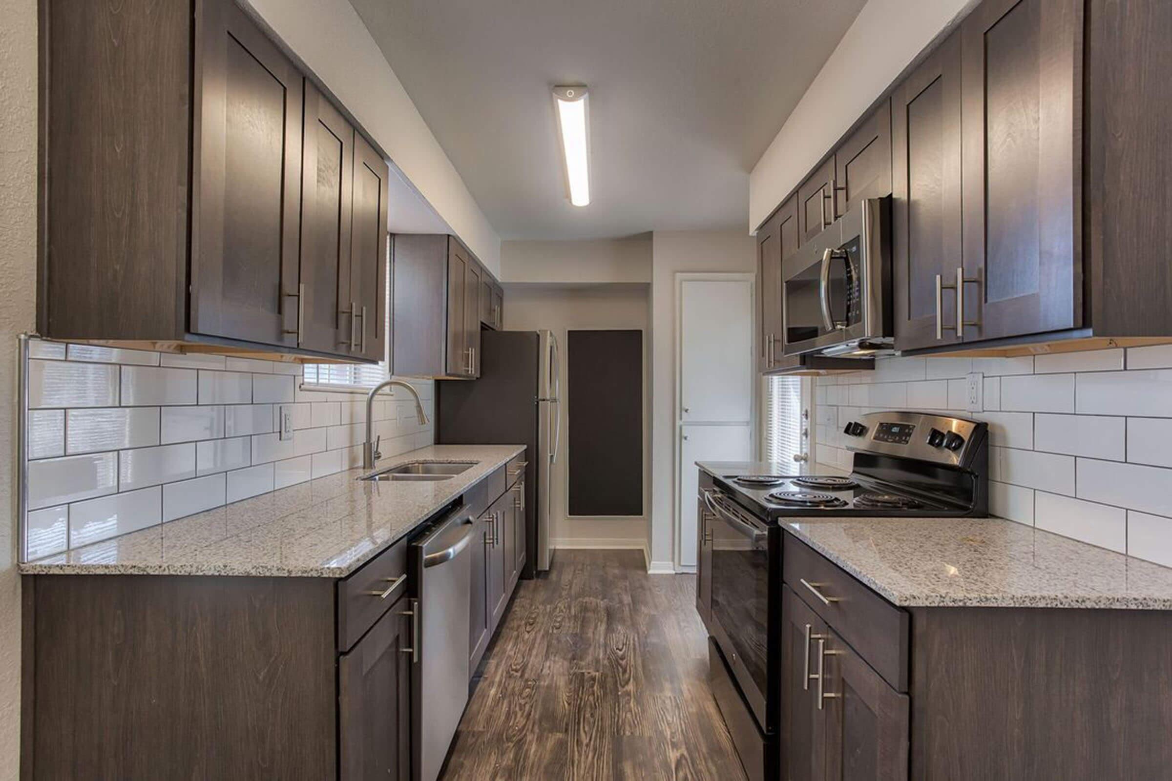 a large kitchen with stainless steel appliances
