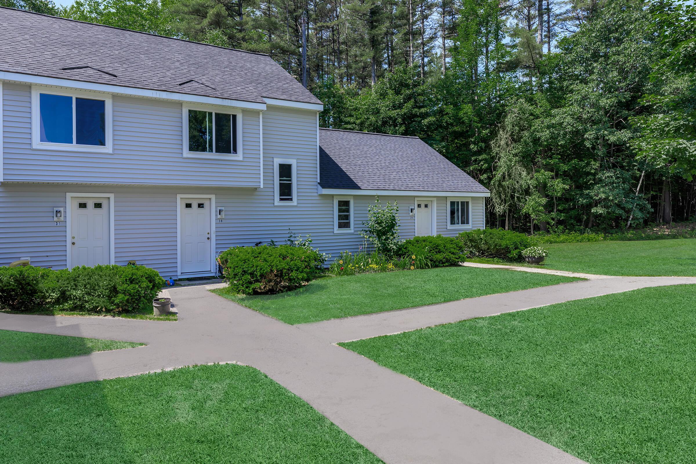 a large lawn in front of a house