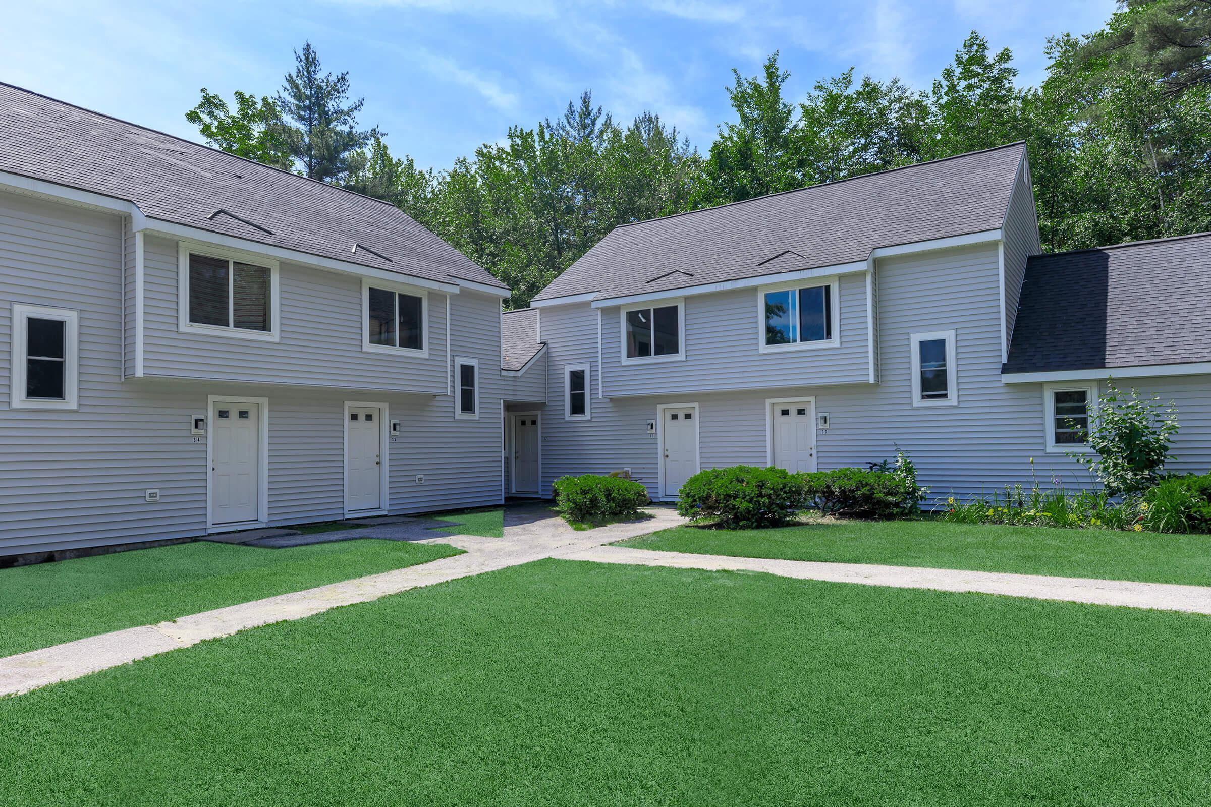 a large lawn in front of a house