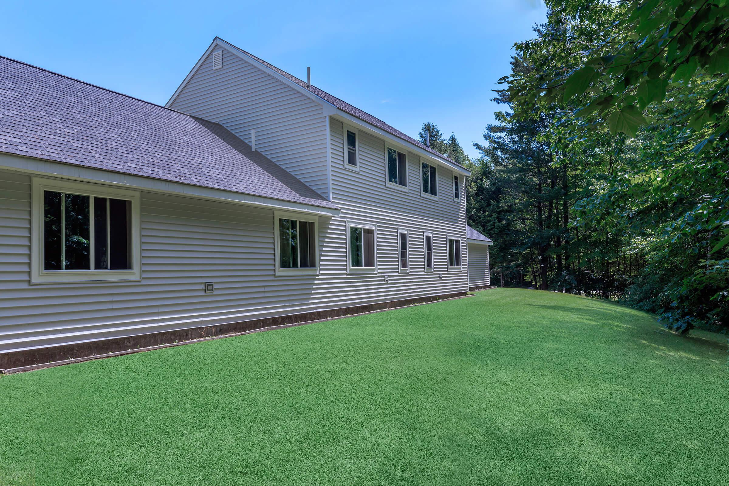 a large lawn in front of a house