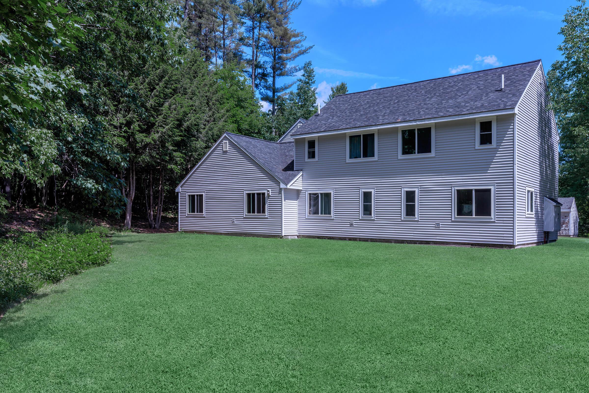 a large lawn in front of a house